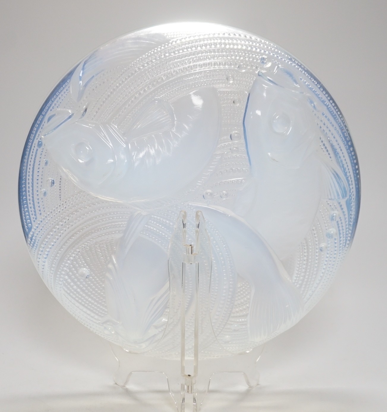 Pierre D'Avesn - a Lalique style opalescent glass dish, moulded in relief with three carp among waves, 30cm diameter